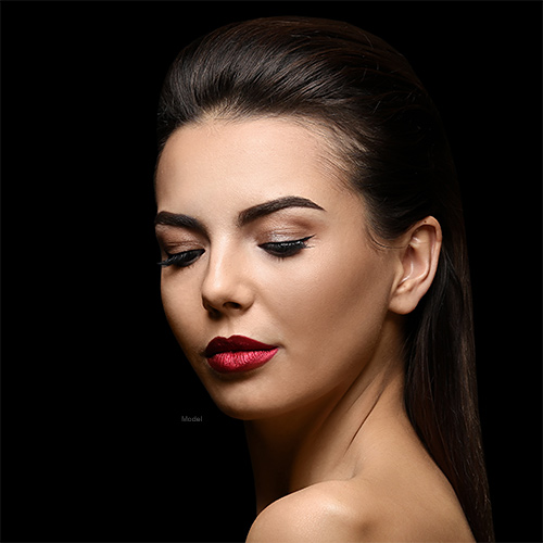 Woman with red lip stick closing her eyes